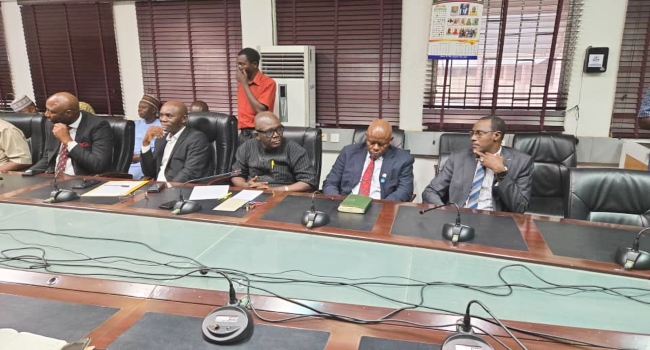 NUPENG and Dangote Refinery officials at a meeting, signing an MoU to formalise workers’ union rights and suspend strike action.