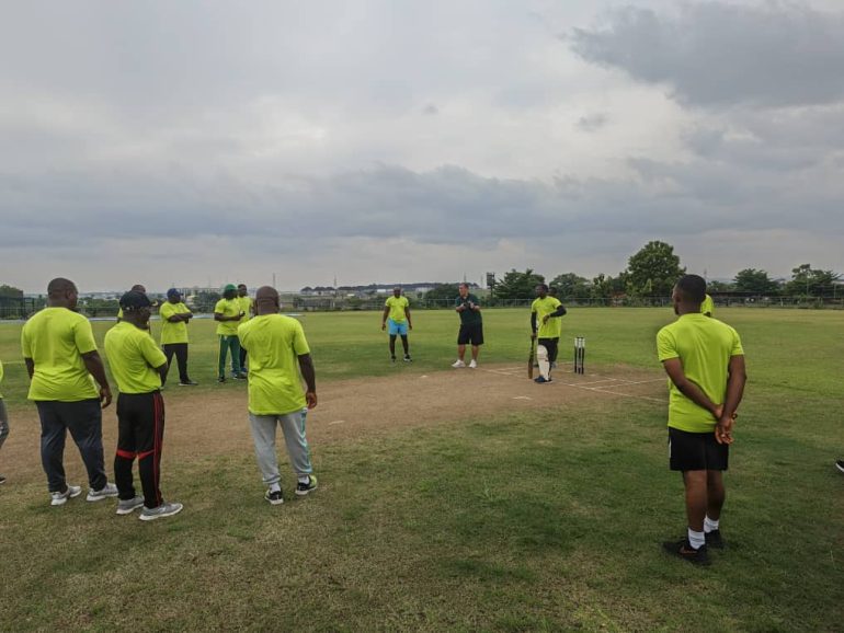 Seventeen Nigerian cricket coaches celebrate earning ICC Level 2 Certification after training in Abuja and Windhoek.