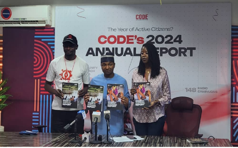 Hamzat Lawal delivers CODE’s 2024 Annual Report in Abuja, highlighting civic engagement, transparency, and education reform.