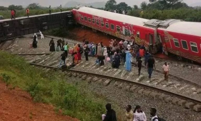 Abuja–Kaduna passenger train derails, leaving overturned carriages and triggering panic as passengers flee the scene; rescue operations are ongoing.