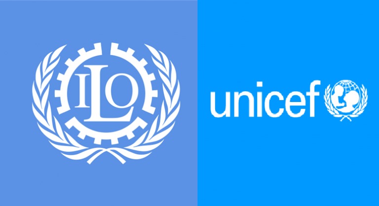 UNICEF and ILO representatives conducting a social protection training workshop for Nigerian policymakers in Abuja, with participants seated and engaging in discussion.