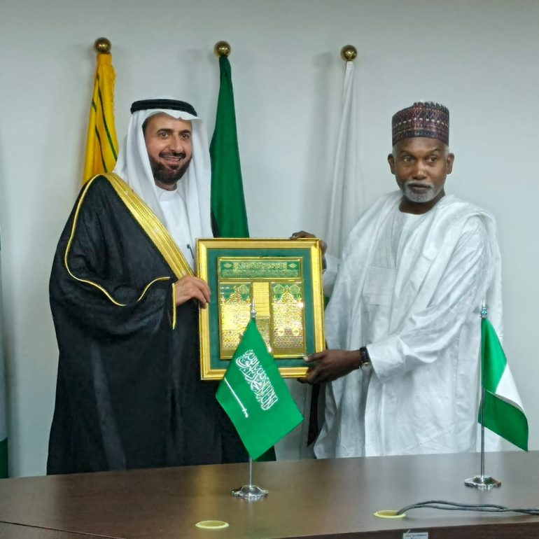 Ambassador Maitama Tuggar and Saudi Minister of Hajj and Umrah shaking hands during a high-level meeting in Abuja