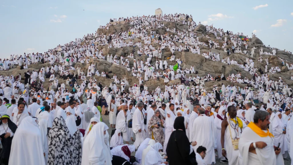Saudi Arabian pilgrims performing Hajj rituals at Mount Arafat ahead of Eid al-Adha, with official announcement of 2026 pilgrimage dates