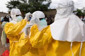 Health officials in protective equipment during Ebola response and containment operations.