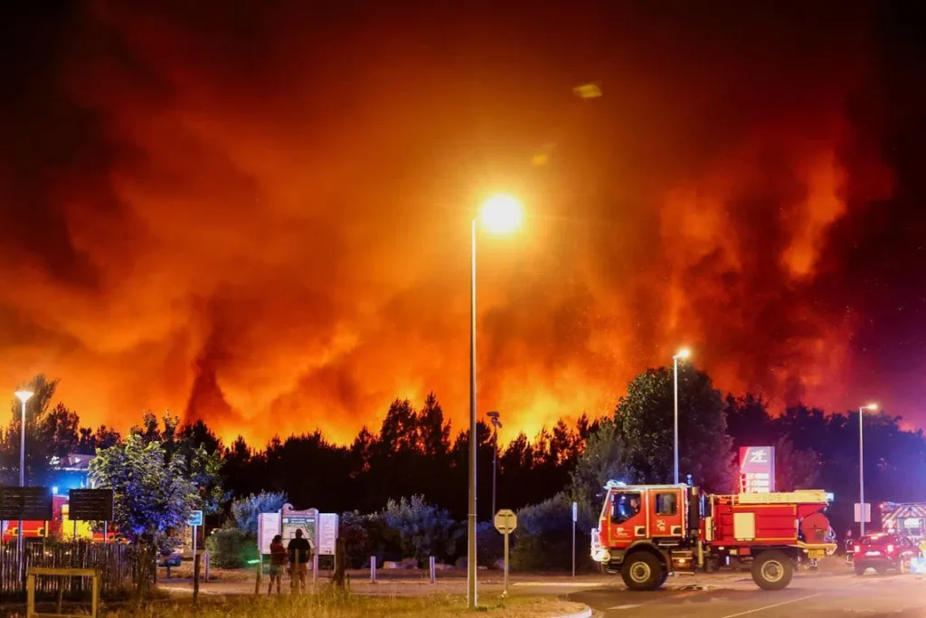 Firefighters battle a fast-moving wildfire in southwest France as thousands of residents and tourists are evacuated from the Gironde region