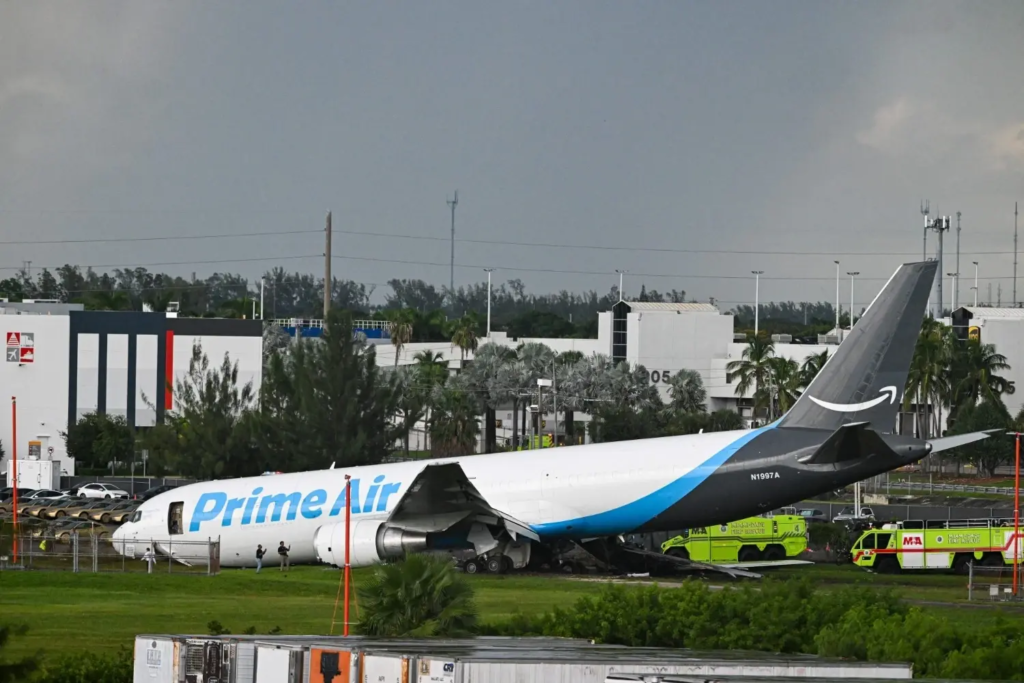 Officials investigate an Amazon Prime Air cargo plane after it crashed at Miami International Airport.