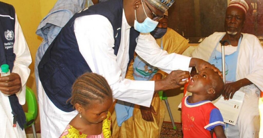 Health workers administer polio vaccines to children during an immunisation campaign in Yobe State.
